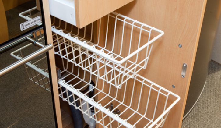 Pull-out wire shelves make the most of narrow cupboard space