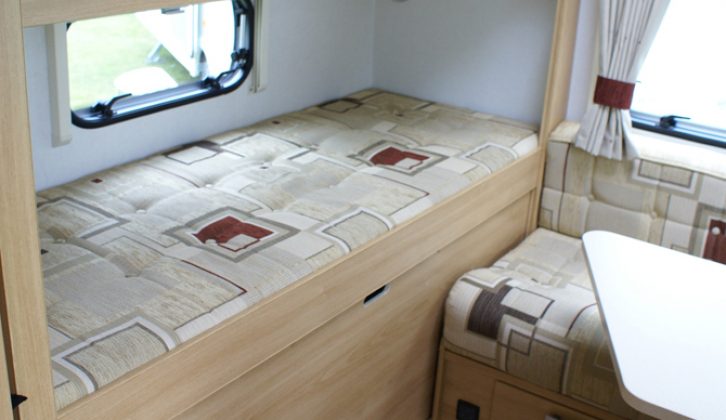Bottom bunk converts  into storage space