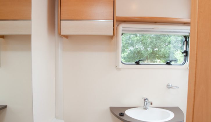 Good-size end washroom but under-basin cupboard is hard to see into