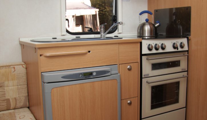 The Adria Adora 542's kitchen has limited worktop but storage and equipment are good
