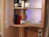 The Adria Adora 542's cocktail cabinet has deep shelves and the small shelf below is handy for keys, say Practical Caravan's expert reviewers
