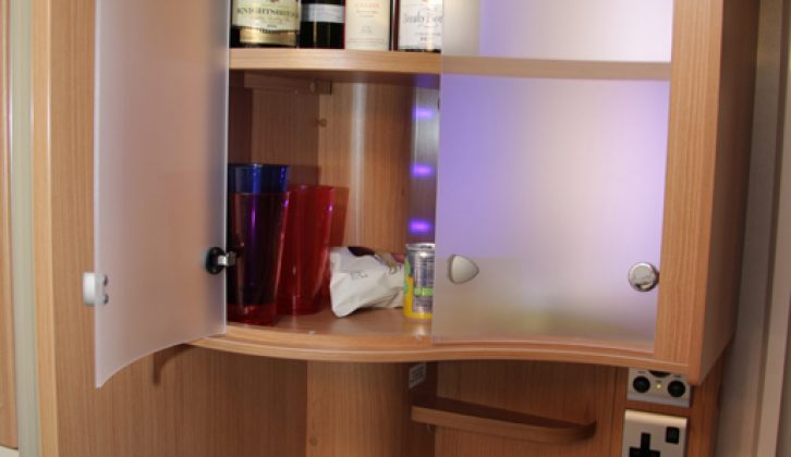 The Adria Adora 542's cocktail cabinet has deep shelves and the small shelf below is handy for keys, say Practical Caravan's expert reviewers