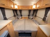 The roomy front bed sits on sliding wood slats in the 2010 Elddis Avanté 505: read our expert review