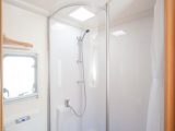 The cutting-edge shower cubicle is spoilt by the curtain