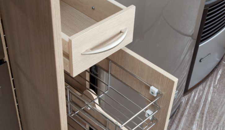 Pull-out wire shelves make the most of narrow cupboard space in the 2010 Sterling Eccles Moonstone: Practical Caravan's expert review