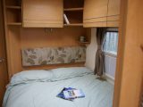 The fixed bed is as long and wide as those in wider caravans