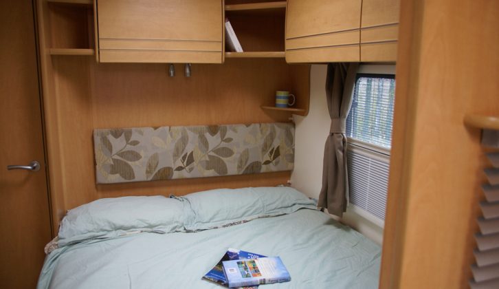 The fixed bed is as long and wide as those in wider caravans