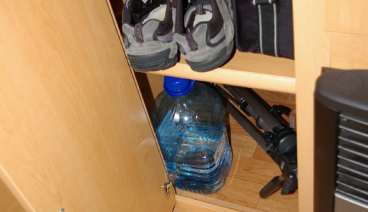 Cupboard beneath wardrobe is a useful place to keep shoes