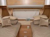 Fixed single beds have sprung mattresses with memory foam toppers in the 2010 Rimor Polaris 530LG reviewed by Practical Caravan's experts
