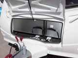 The front locker door is held high by a central gas strut in the five-berth Coachman Amara 550/5 – read Practical Caravan's expert verdict, with the full spec and prices