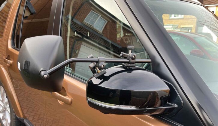 A car with towing mirrors attached