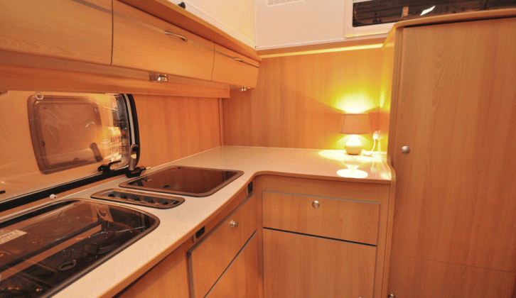 Storage space abounds in the corner kitchen of the Trigano Silver 310 TL pop-top caravan reviewed by the experts at Practical Caravan