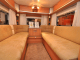 Rear lounge area with luxury upholstery, plenty of roof lockers too