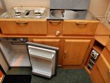 Dometic fridge is fitted along with twin burner hob and grill in the Gobur Carousel Slimline 10/2 folding caravan