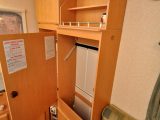 Wardrobe has just about enough hanging space for two in the Gobur Carousel Slimline 10/2 folding caravan
