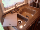 Double sink, drainer and surrounds are a one-piece unit
