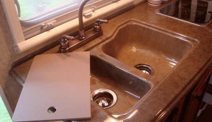 Double sink, drainer and surrounds are a one-piece unit