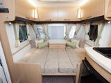 Made up double bed and lounge storage lockers in the 2012 Elddis Crusader Shamal four-berth caravan reviewed by Practical Caravan's experts