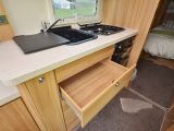 The black-enamel sink and hob, large worktop and huge drawers make the kitchen attractive and practical