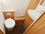 The nearside washroom has the toilet, hand basin and cupboards