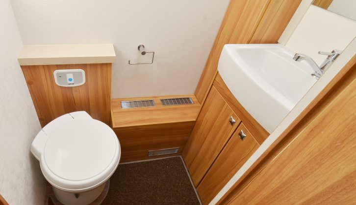 The nearside washroom has the toilet, hand basin and cupboards