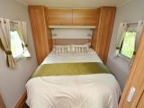 You can access the island bed from either side, and it is flanked by twin wardrobes.