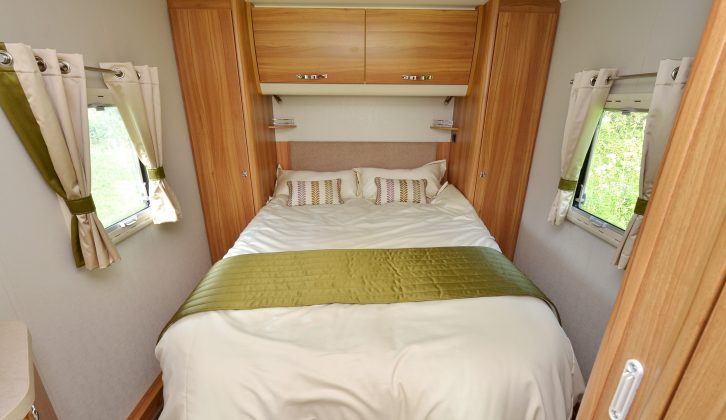 You can access the island bed from either side, and it is flanked by twin wardrobes.