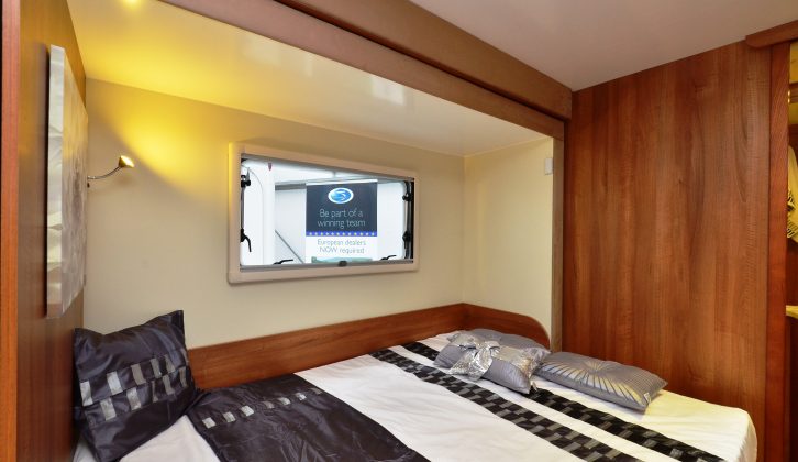 The fixed double bed is roomy, but it lacks reading lamps and small shelves