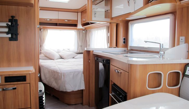 Roof lockers surround the 465's interior, bolstered by a two-door wardrobe and other storage options. The fixed bed is large and has a supportive mattress. Some people may miss having a headboard and a shelf to rest a cuppa. The nearside kitchen's space took a hit for the sake of the long fixed bed and the comfortable lounge