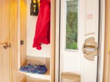 The small alcove includes a place to hang wet jackets and put shoes