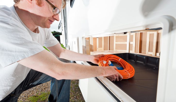 A hatch on the nearside allows items to be fed into the fixed bed's storage cavity