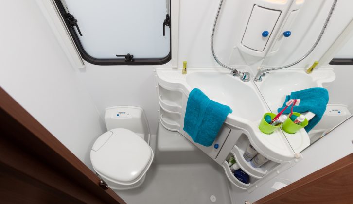 The wheel box and basin eat into the usable space in the compact washroom