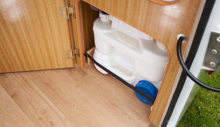 The toilet is basic. When not in use, it's tank can be hidden away