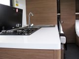 The stylish kitchen features an L-shaped hob and sink set-up