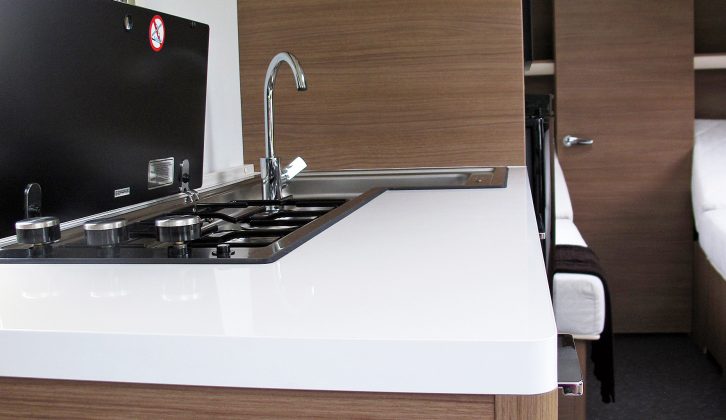 The stylish kitchen features an L-shaped hob and sink set-up