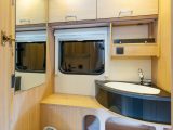The compact washroom has a Thetford swivel-seat toilet, a good-sized corner basin and plenty of storage space. But it lacks a shower, and there's no ceiling to close the washroom off entirely from the rest of the tourer