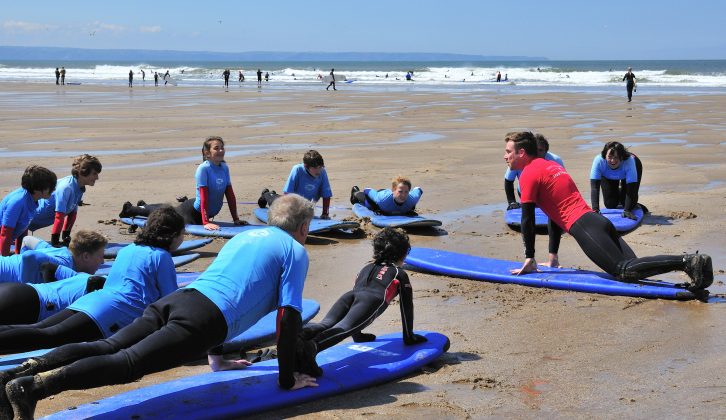 You can learn surfing with the surf school at Croyde beach duirng your caravan holidays in Devon
