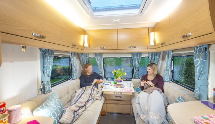 The warm interior lighting, light oak furniture and attractive turquoise soft furnishings knit together in the Compass Corona 462 to create a pleasant lounge ambience.