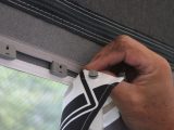 The curtain system in this Magnum 250 Coal awning is unique to Isabella and the Practical Caravan team found it easy to put together
