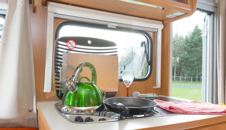 Sterckeman Alizé 370CE kitchen has a three-burner hob, sink, dual-fuel fridge with freezer and three large drawers