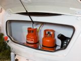 Gas locker lid lifts up high for easy access to cylinders