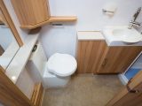 The washroom offers plenty of dressing space, but the laundry basket impedes the toilet, which must be swivelled slightly