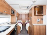 The Elddis Affinity 574's kitchen has a cocktail cabinet and a microwave which impressed the Practical Caravan review team