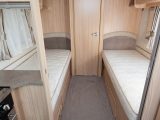 The beds in the Coachman Pastiche 565/4 have sprung mattresses, lights and storage, but are a bit short – read more in our review