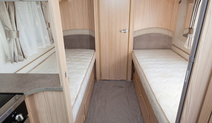 The beds in the Coachman Pastiche 565/4 have sprung mattresses, lights and storage, but are a bit short – read more in our review