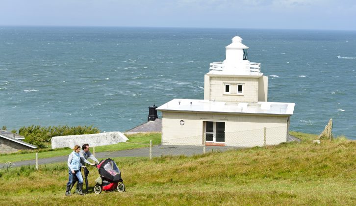 When you stay at campsites in Devon, use the South West Coast Path walking trail and visit Bull Point lighthouse for spectacular sea views