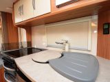 The kitchen in the Lunar Quasar 525 has ample worktop, storage options and appliances to prepare family meals, say Practical Caravan's reviewers