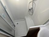 The shower cubicle in the Lunar Quasar 525 is not fully lined, but Practical Caravan's experts noted with approval that it has the excellent Ecocamel showerhead