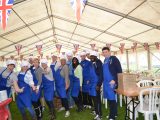 The team donned chef's hats and aprons ready for the mammoth barbecue service, feeding hundreds of hungry rallyers