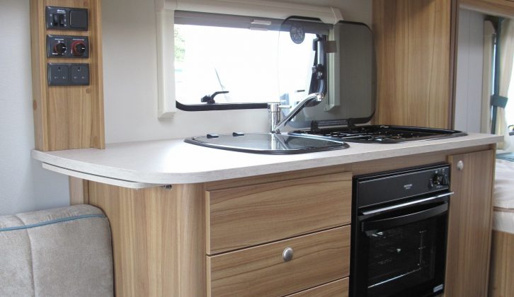 Xplore 574's kitchen is minimal, say Practical Caravan's reviewers, with a small oven/grill, though it has a worktop extension and plenty of storage space